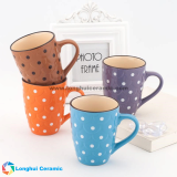 Embossed ceramic mug with color glaze and white dots painted